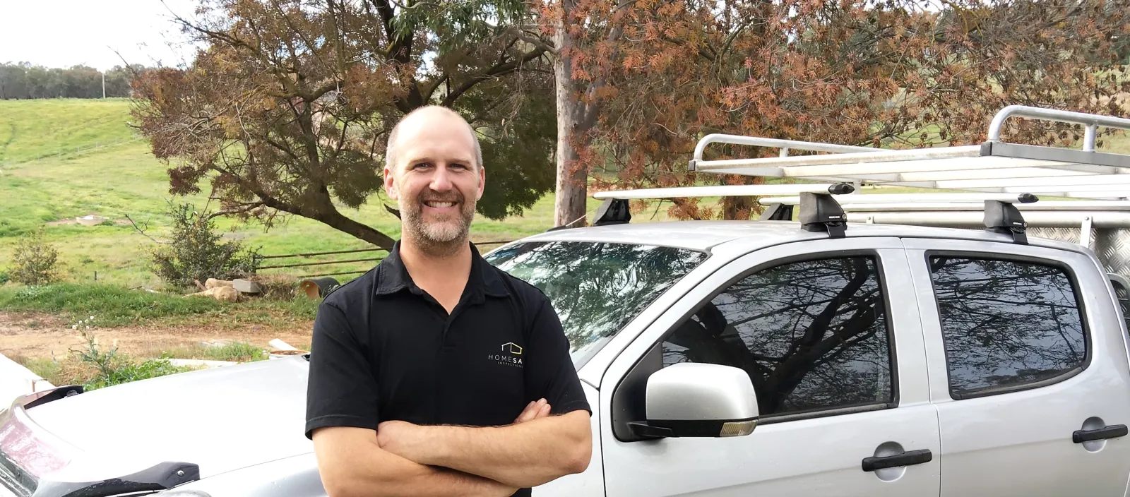 Pieter Slee, Homesafe Inspections Albury–Wodonga inspector, standing beside his Homesafe vehicle